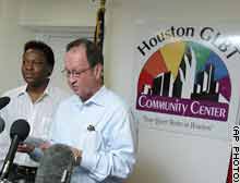 The two men who spent the night in jail in 1998 on sodomy charges, John Lawrence, right, and Tyron Garner, read a statement during a news conference in Houston.